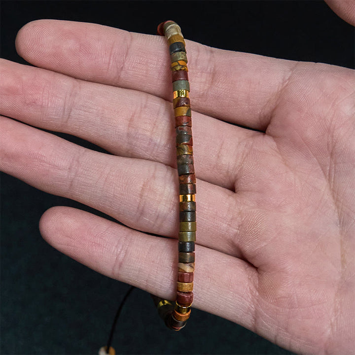 Bracciale con perline distanziatrici in rodonite e Buddha Stones per la guarigione delle relazioni