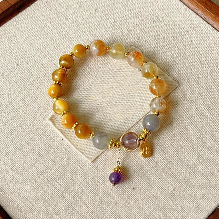 Bracciale della prosperità con carattere Fu in occhio di tigre citrino naturale Buddha Stones