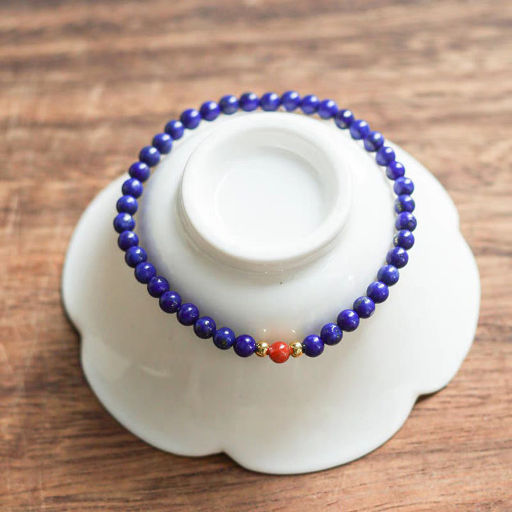 Braccialetto positivo con perle ultrasottili di cinabro e piccole Buddha Stones