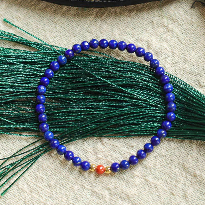 Braccialetto positivo con perle ultrasottili di cinabro e piccole Buddha Stones