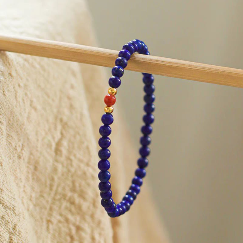 Braccialetto positivo con perle ultrasottili di cinabro e piccole Buddha Stones