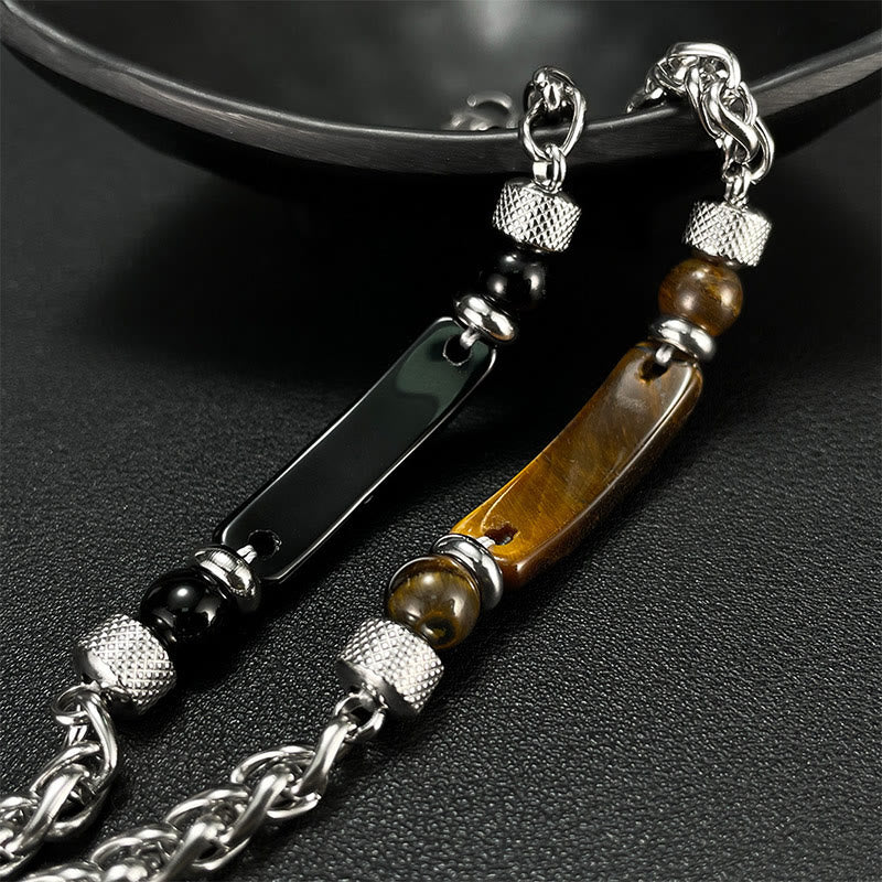 Bracciale con fibbia in acciaio al titanio e pietra di ossidiana nera con occhio di tigre Buddha Stones