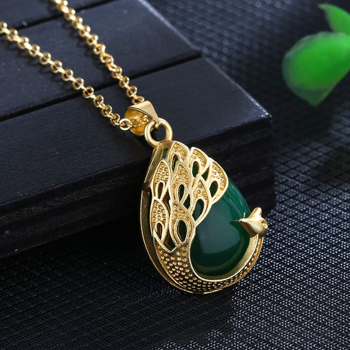 Collana pendente con ciondolo in cristallo rosa, calcedonio verde, pavone, rame, amore lenitivo