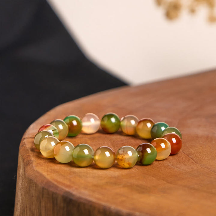 Bracciale Buddha Stones in agata pavone naturale colorata, per la purificazione del coraggio