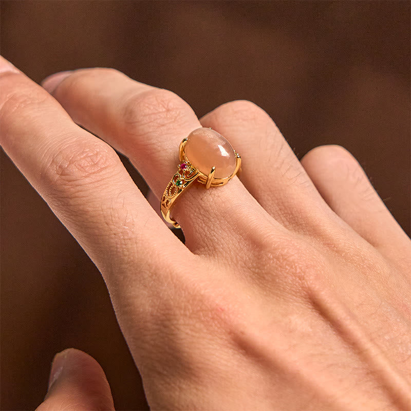 Anello della felicità regolabile con motivo a vite cava Buddha Stones e pietra di luna color pesca