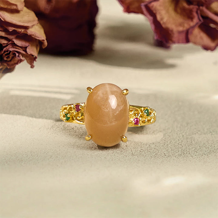 Anello della felicità regolabile con motivo a vite cava Buddha Stones e pietra di luna color pesca