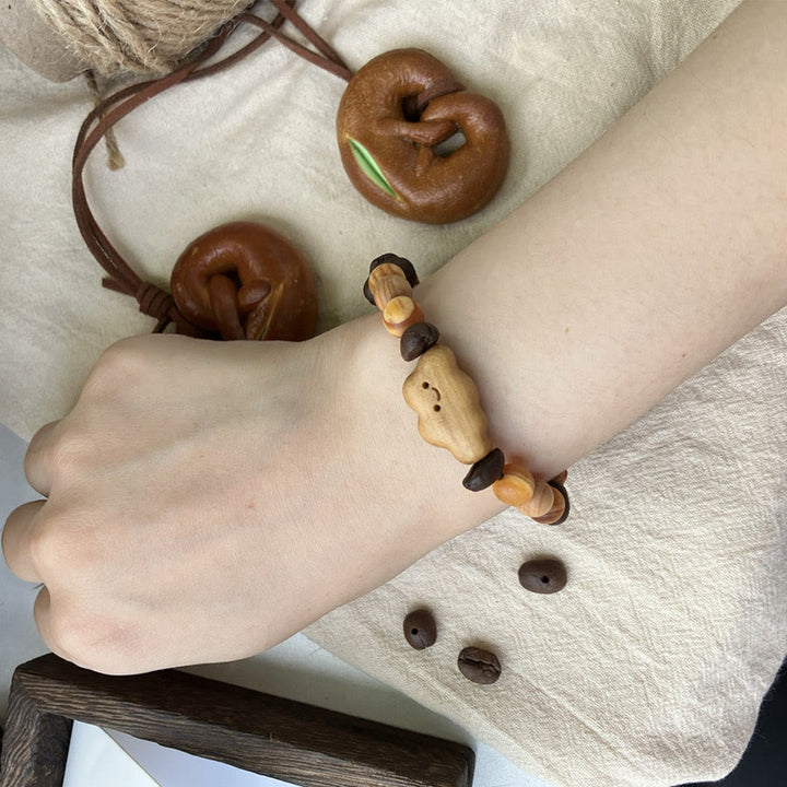 Bracciale di protezione in legno di sandalo con chicchi di caffè e nuvola irregolare naturale Buddha Stones - image 3