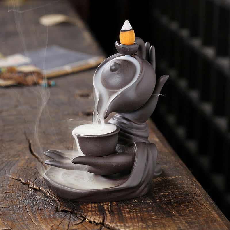 Buddha Stones, mano di Buddha che tiene teiera, tazza, fontana di fumo a riflusso in ceramica, bruciatore di incenso curativo, decorazione - Marrone Nero 13,7*9*13,9cm - image 1