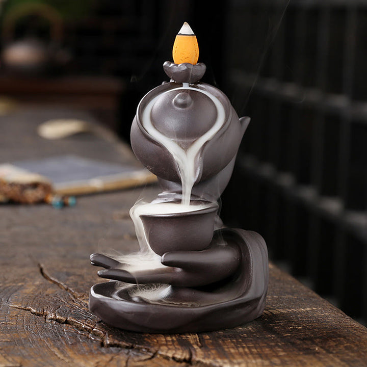 Buddha Stones, mano di Buddha che tiene teiera, tazza, fontana di fumo a riflusso in ceramica, bruciatore di incenso curativo, decorazione - image 1