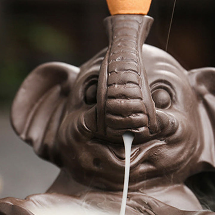 Buddha Stones, piccolo elefante che tiene una foglia, argilla viola, fontana di fumo a riflusso, bruciatore di incenso curativo, decorazione - image 11