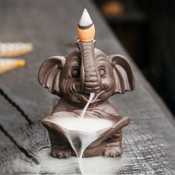 Buddha Stones, piccolo elefante che tiene una foglia, argilla viola, fontana di fumo a riflusso, bruciatore di incenso curativo, decorazione - 7,4*7,9*10,5 cm - image 1