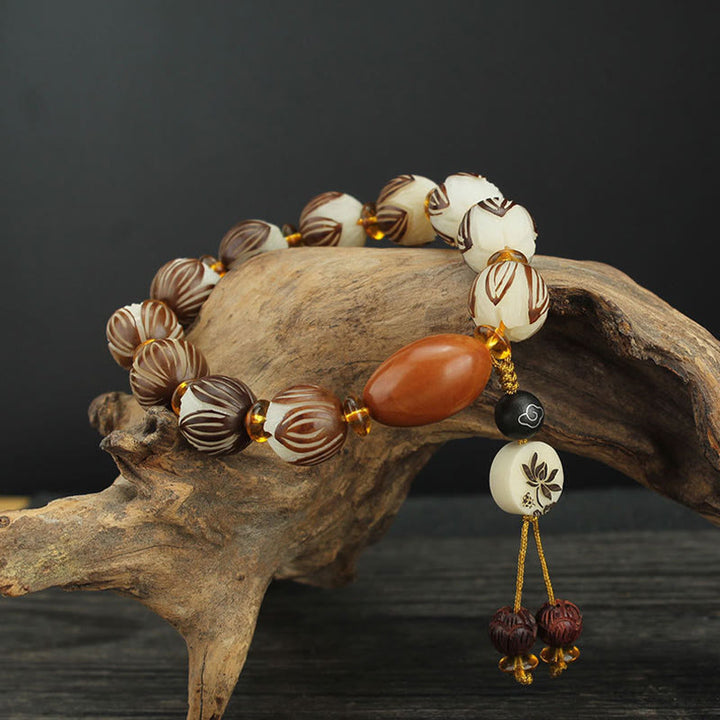 Buddha Stones Bracciale tibetano Mala con semi di Bodhi bianchi e pace - Seme di Bodhi e nucleo olivare (circonferenza del polso: 16-18 cm) - image 0