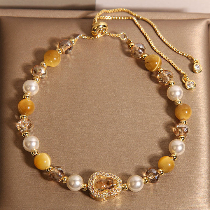 Braccialetto della prosperità con perle di zucca e occhio di gatto giallo Buddha Stones - Occhio di gatto giallo e perla (circonferenza polso: 14-18 cm) - image 1