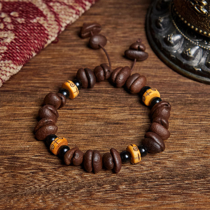 Bracciale con perline di osso di yak e chicchi di caffè naturali Buddha Stones