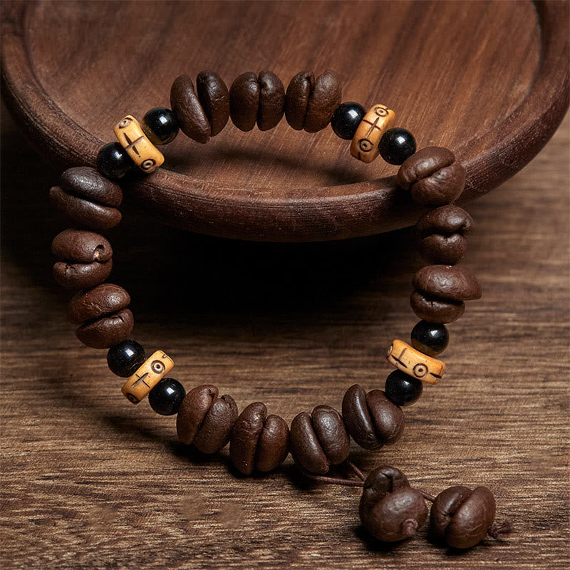 Bracciale con perline di osso di yak e chicchi di caffè naturali Buddha Stones