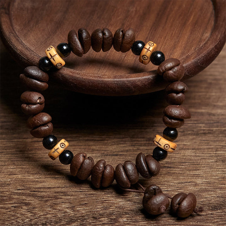 Bracciale con perline di osso di yak e chicchi di caffè naturali Buddha Stones