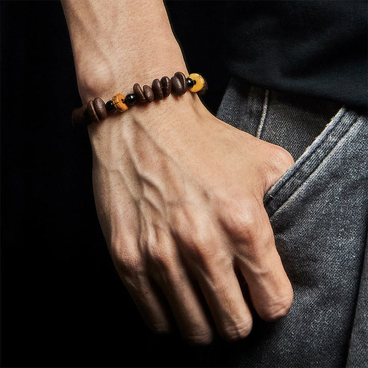 Bracciale con perline di osso di yak e chicchi di caffè naturali Buddha Stones