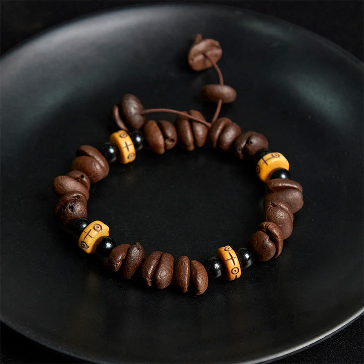 Bracciale con perline di osso di yak e chicchi di caffè naturali Buddha Stones