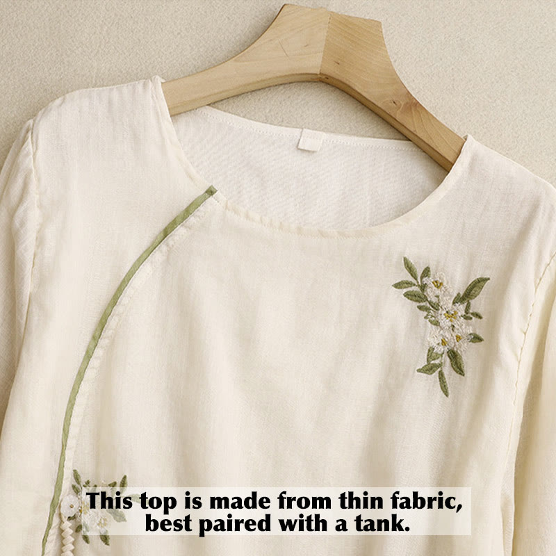 Camicia da donna a maniche a tre quarti con scollo rotondo e ricamo floreale a foglie verdi, colore beige Buddha Stones. - image 2