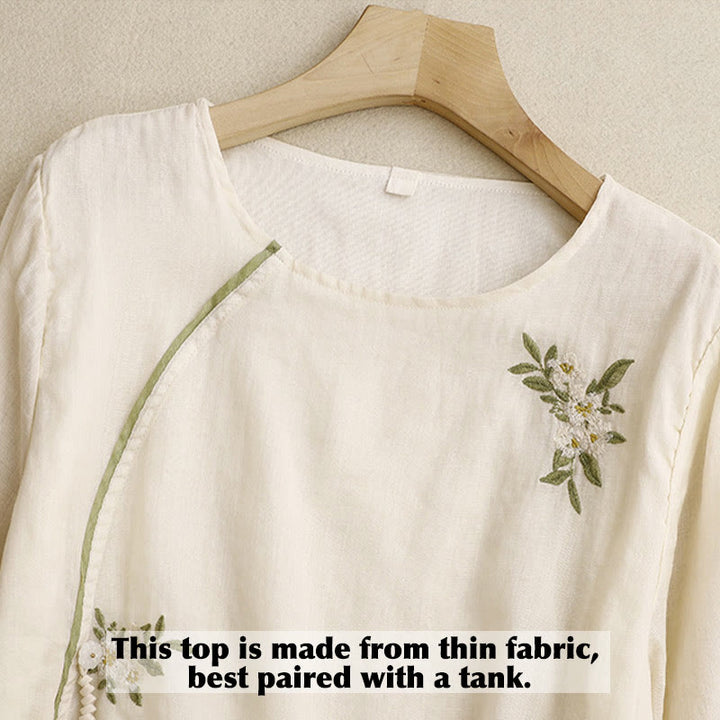 Camicia da donna a maniche a tre quarti con scollo rotondo e ricamo floreale a foglie verdi, colore beige Buddha Stones. - image 2