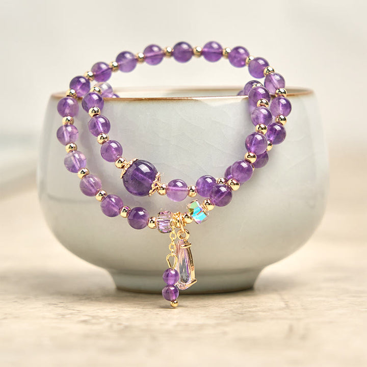 Bracciale multistrato in perle di ametista naturale Buddha Stones