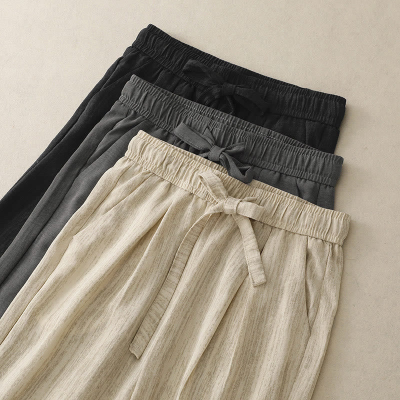Pantaloni da donna in cotone a gamba larga con tasche, modello Buddha Stones, casual, estivi, con lacci e texture.