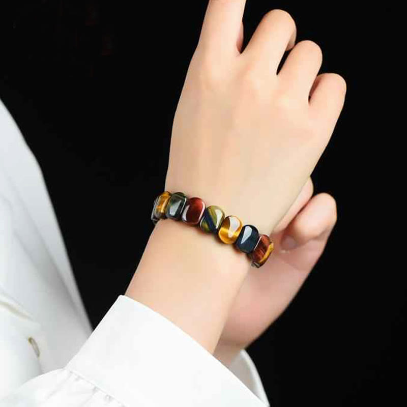 Bracciale Buddha Stones con perle ovali in occhio di tigre colorato naturale