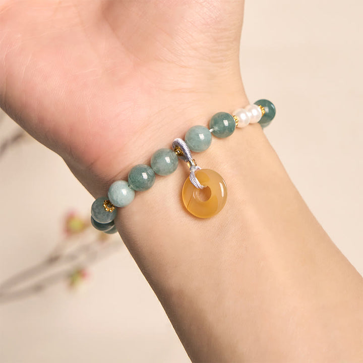 Bracciale della prosperità con perle e fibbia della pace in giada blu Buddha Stones
