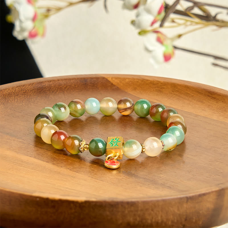 Braccialetto del coraggio con moneta in agata pavone naturale Buddha Stones