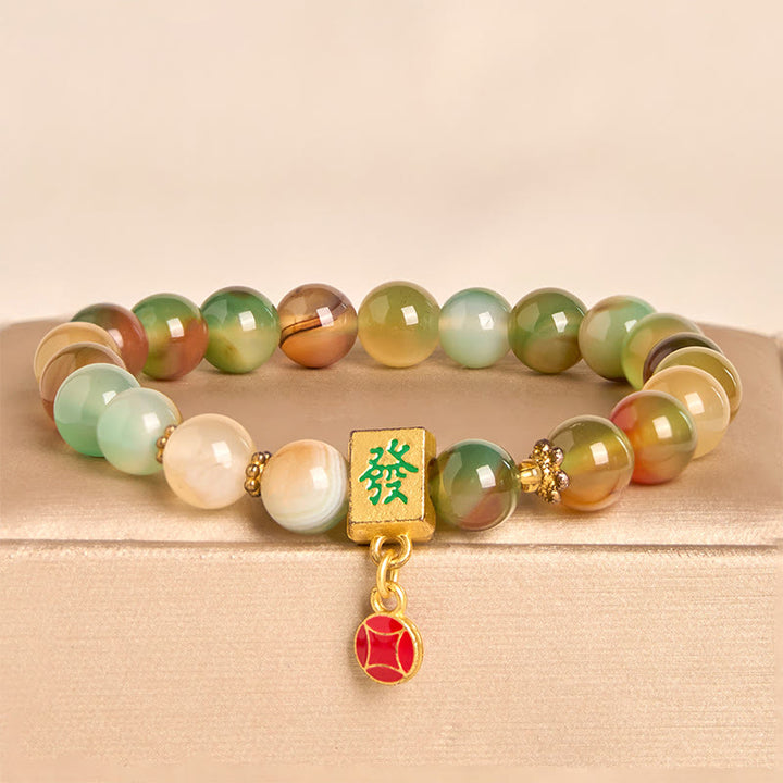 Braccialetto del coraggio con moneta in agata pavone naturale Buddha Stones