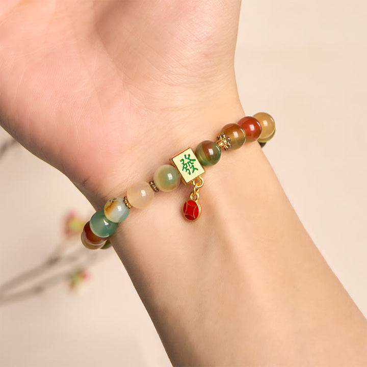 Braccialetto del coraggio con moneta in agata pavone naturale Buddha Stones