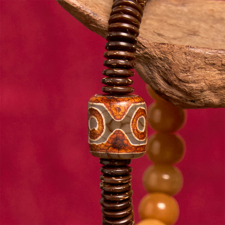 Bracciale della saggezza con perline di Dzi, semi di Bodhi tibetani , Buddha Stones e guscio di cocco