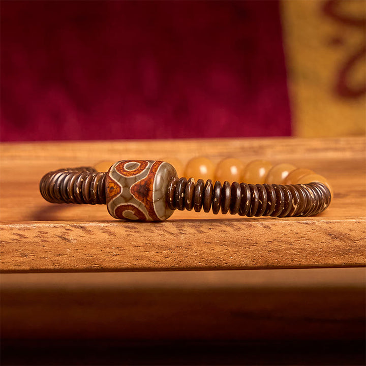 Bracciale della saggezza con perline di Dzi, semi di Bodhi tibetani , Buddha Stones e guscio di cocco