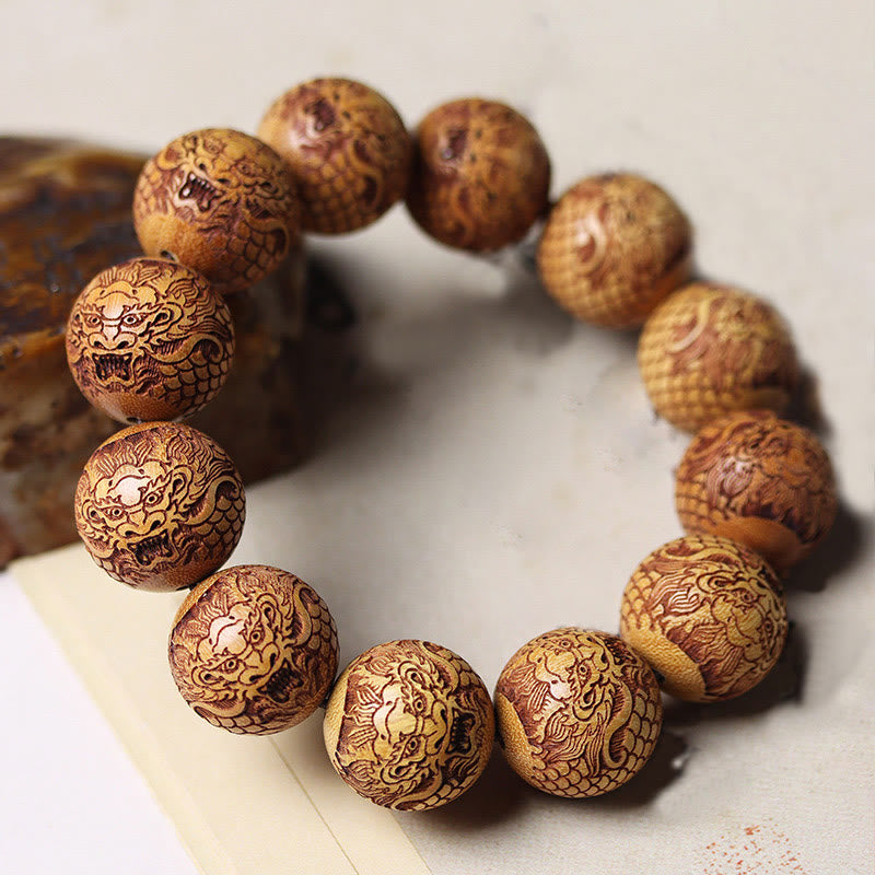 Bracciale Buddha Stones intagliate in sandalo e drago che tiene lontani gli spiriti maligni - image 2