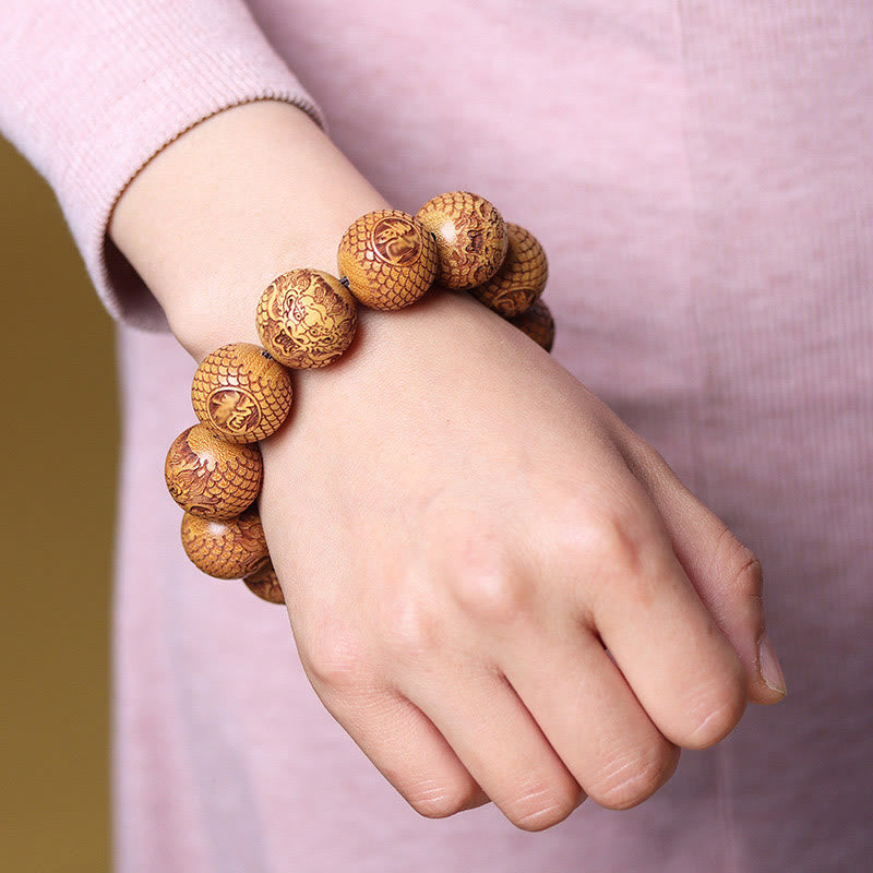 Bracciale Buddha Stones intagliate in sandalo e drago che tiene lontani gli spiriti maligni - image 3