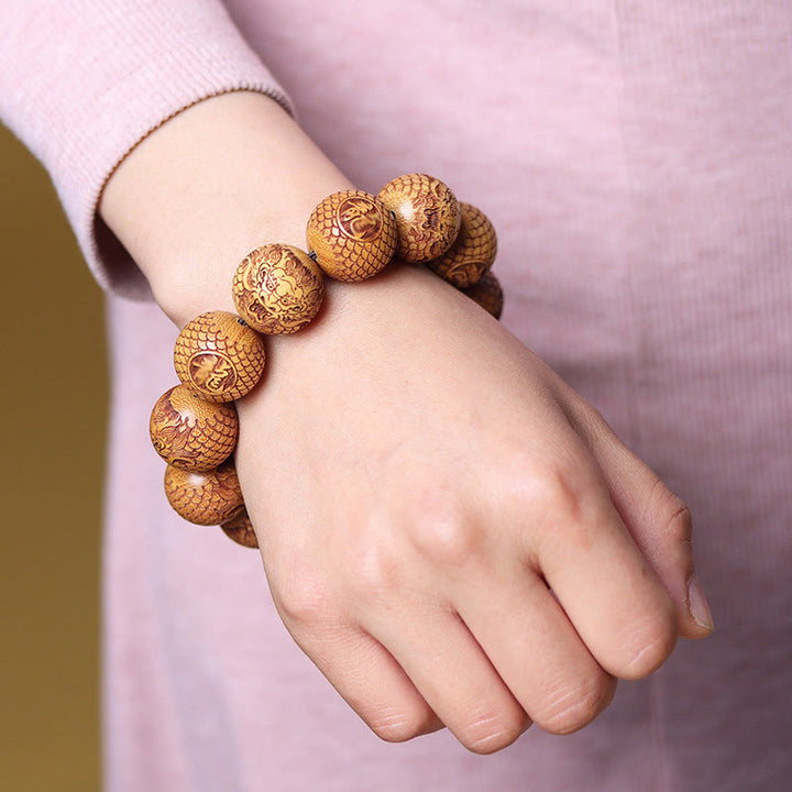 Bracciale Buddha Stones intagliate in sandalo e drago che tiene lontani gli spiriti maligni - image 3