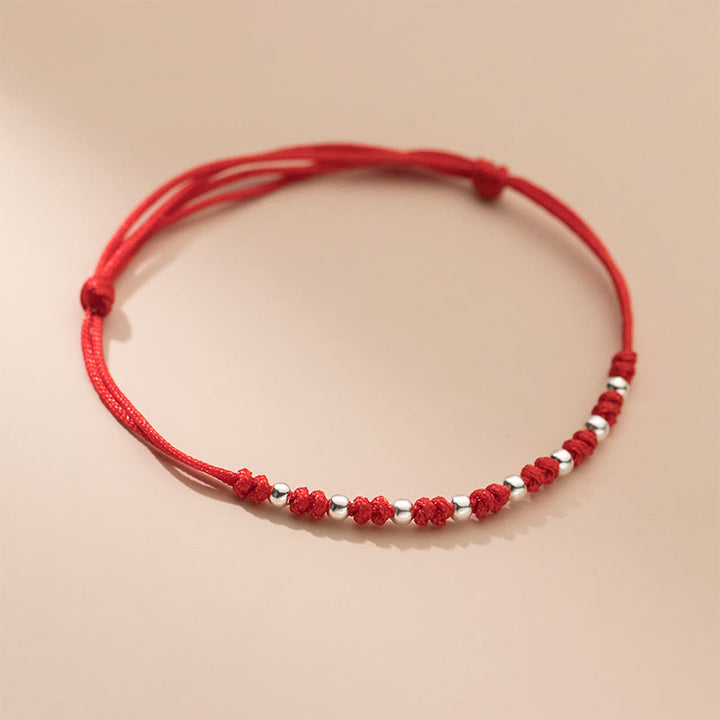 Braccialetto portafortuna regolabile con perline in argento sterling 925 e cordino rosso Buddha Stones - image 8