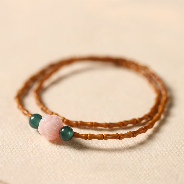 Buddha Stones Bracciale doppio cerchio ultra sottile con noccioli di oliva e loto per la forza interiore - Nocciolo di oliva (circonferenza del polso: 14-15 cm) - image 0