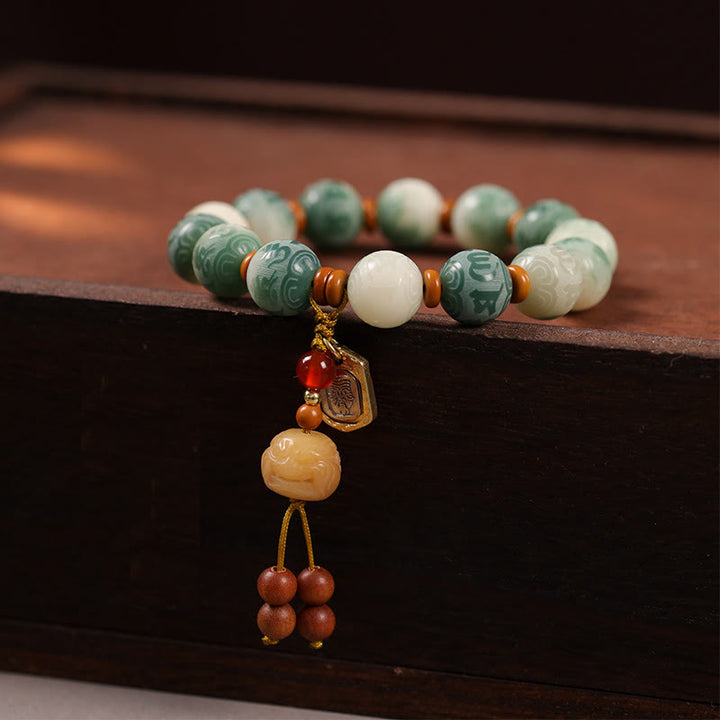 Bracciale della pace in zakiram intagliato con Buddha Stones e semi di Bodhi sfumati, Om Mani Padme Hum - Bodhi Seed e Zakiram (circonferenza del polso: 15-16 cm) - image 1