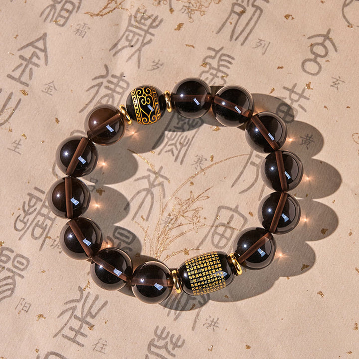 Braccialetto Buddha Stones Ice Obsidian con timbro oro in sanscrito e coraggio
