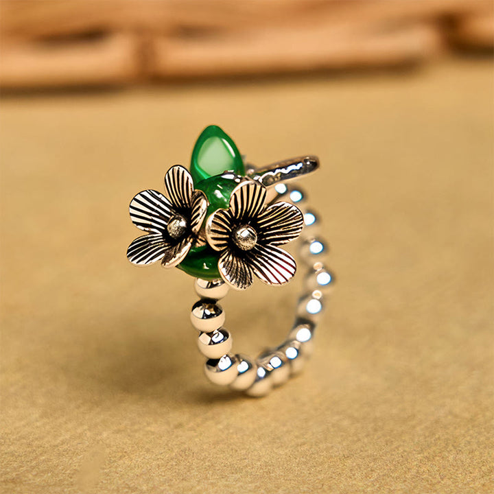Anello elastico portafortuna in lega di rame con motivo floreale e Buddha Stones - 14-20 mm (corda elastica) - image 1