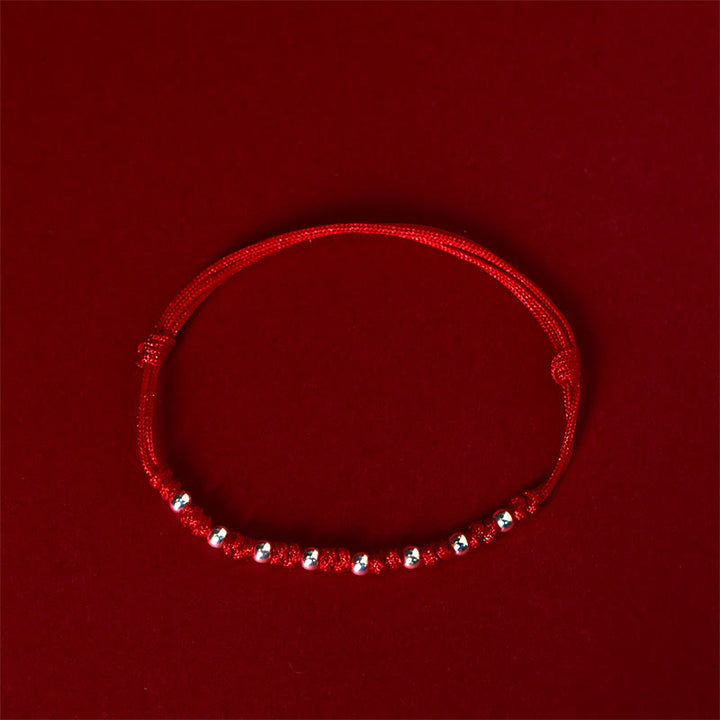 Braccialetto portafortuna regolabile con perline in argento sterling 925 e cordino rosso Buddha Stones - image 2