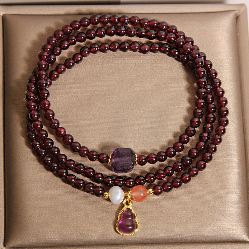 Bracciale multistrato con protezione in granato naturale, ametista e zucca Buddha Stones - image 2