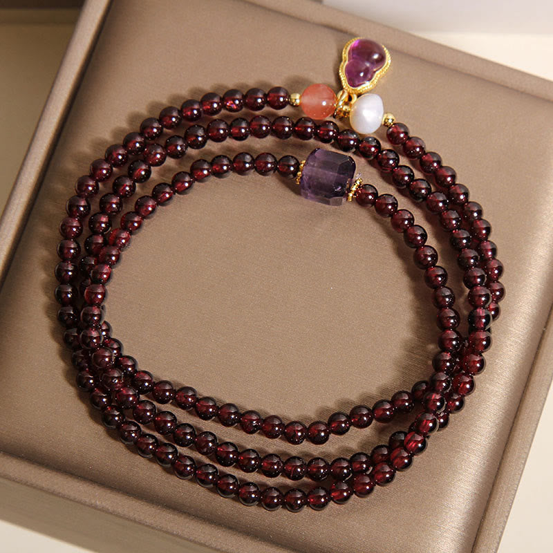 Bracciale multistrato con protezione in granato naturale, ametista e zucca Buddha Stones - image 3