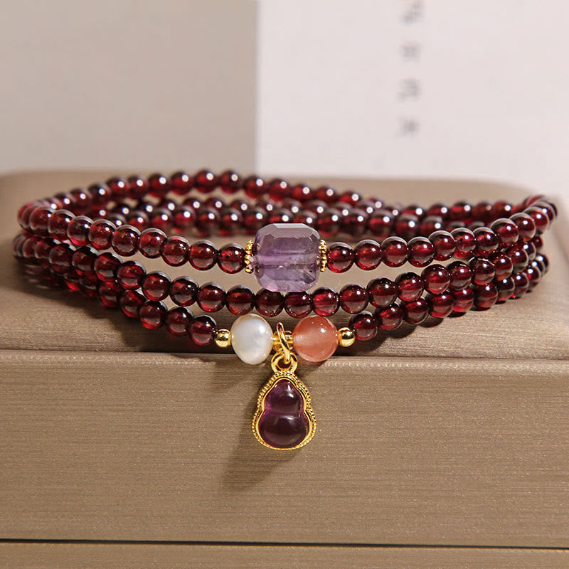 Bracciale multistrato con protezione in granato naturale, ametista e zucca Buddha Stones - image 5