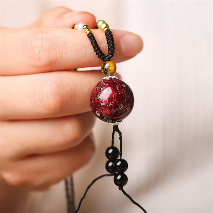 Collana con ciondolo in pietra Buddha Stones, legno di ebano, perlina di Venere, Aurora, lacca artigianale, pace - Fascino rosso (rosso casuale) - image 1