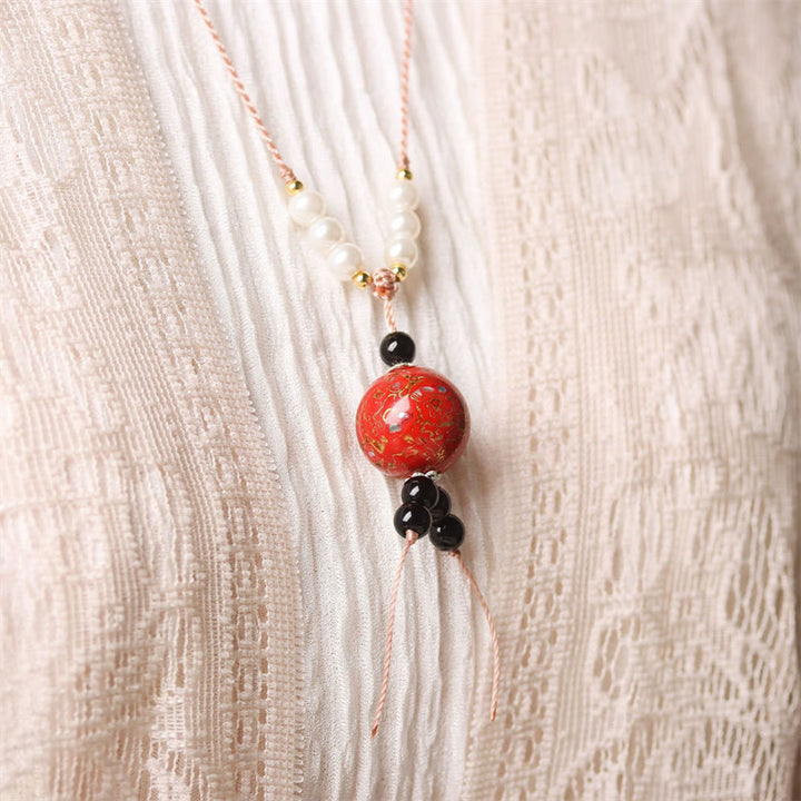 Collana con Buddha Stones, ebano, lacca Aurora, perline artigianali, perle, equilibrio - image 9