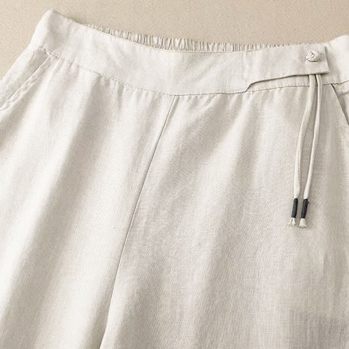 Pantaloni capri da donna a gamba larga con un bottone e tasche, tinta unita, con stampa Buddha Stones . - image 15