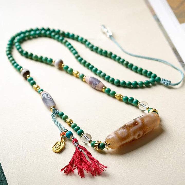 Collana con ciondolo di protezione in pietra Buddha Stones Dzi tibetana, perlina turchese - image 4
