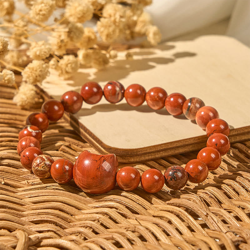 Braccialetto portafortuna turchese rosso con testa di gatto senza volto di Buddha Stones - image 1
